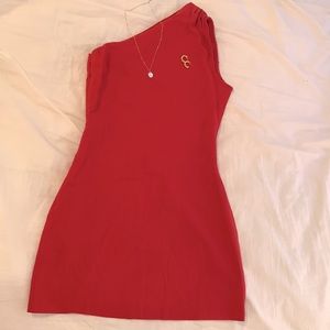 Red one shoulder dress.